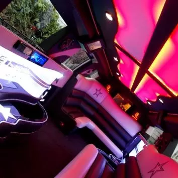 Luxurious limo interior with red lighting.
